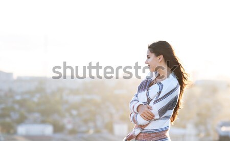 Young woman outdoors on city background in sunny day Stock photo © dashapetrenko