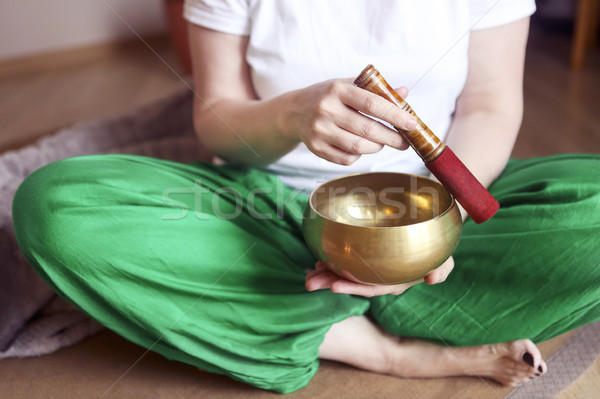 Tibetan singing bowl in the hands of a woman Stock photo © dashapetrenko