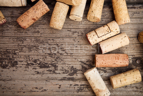 Stock photo: Dated wine bottle corks on the wooden background