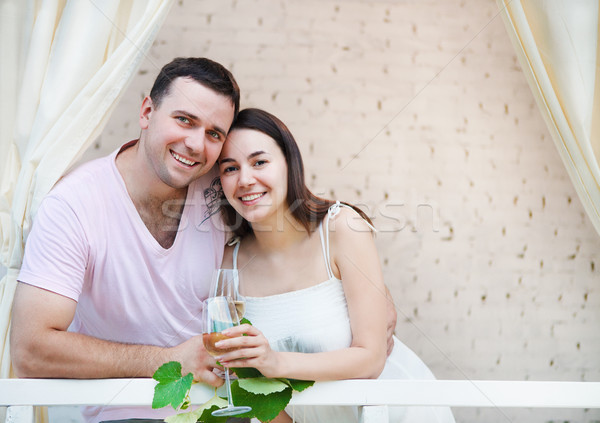 Couple enjoying a glasses of white wine on terrace Stock photo © dashapetrenko