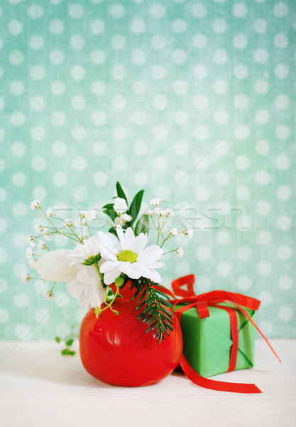 Bouquet of winter flowers with present  Stock photo © dashapetrenko