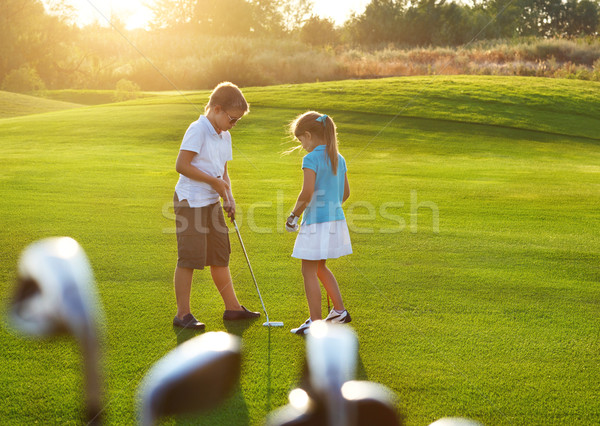 Gündelik çocuklar golf alan golf kulüpleri Stok fotoğraf © dashapetrenko