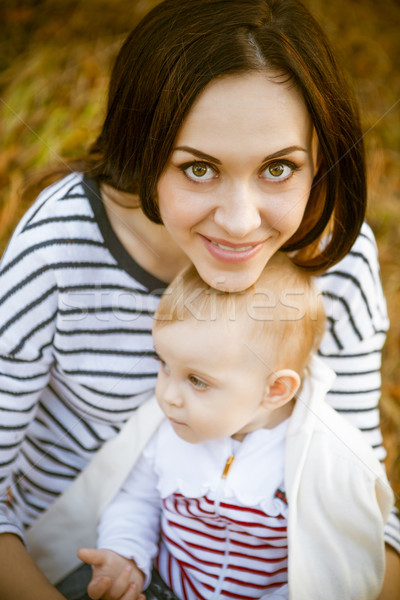 Mother with her baby daughter in autumn park Stock photo © dashapetrenko