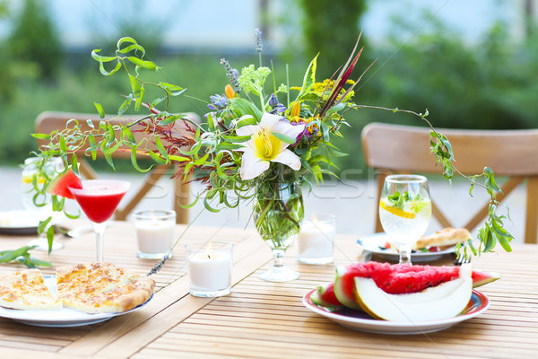 Summer outdoor party decorated with flowers Stock photo © dashapetrenko