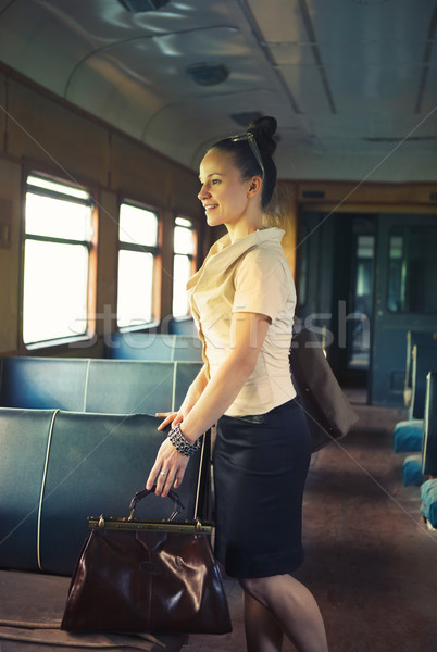 Woman with a suitcase walking in the retro train Stock photo © dashapetrenko
