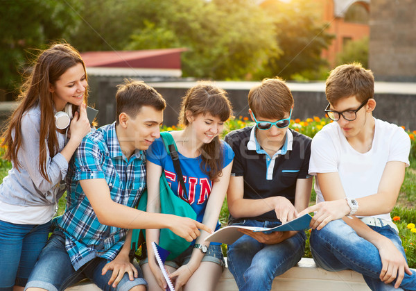 Group of students or teenagers with notebooks outdoors  Stock photo © dashapetrenko