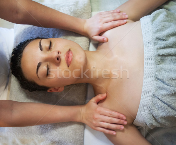Masseur doing facial massage of an adult woman  Stock photo © dashapetrenko
