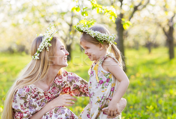 Happy mother and her little daughter in the spring day  Stock photo © dashapetrenko