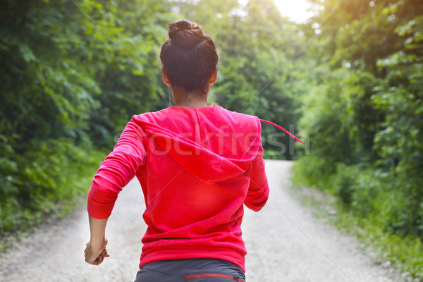 Young lady running on a rural road in the morning Stock photo © dashapetrenko