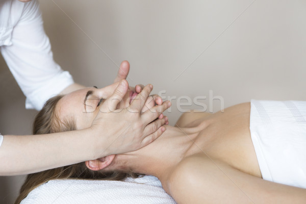Face massage or beauty treatment in spa salon Stock photo © dashapetrenko