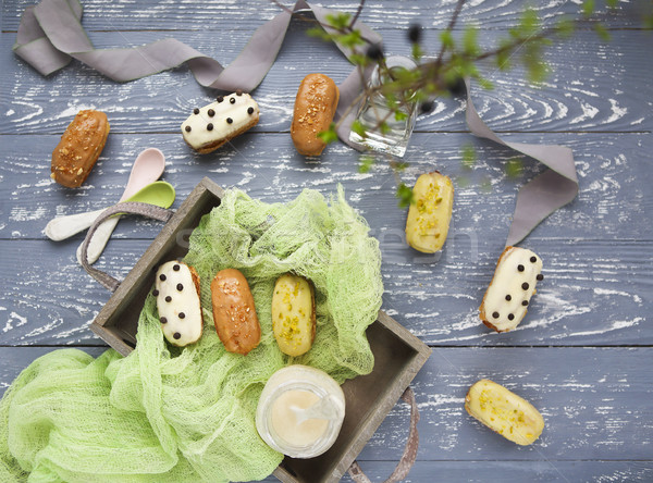 Eclairs with chocolate and whipped cream on dark background Stock photo © dashapetrenko