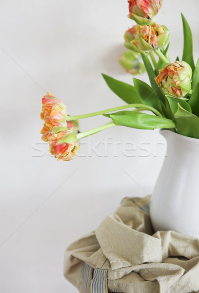 Tulips bouquet in white vase on wooden rustic chair  Stock photo © dashapetrenko