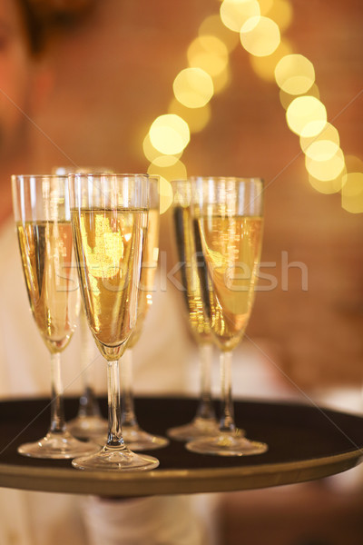 Champagne glasses on tray. Party and event concept Stock photo © dashapetrenko