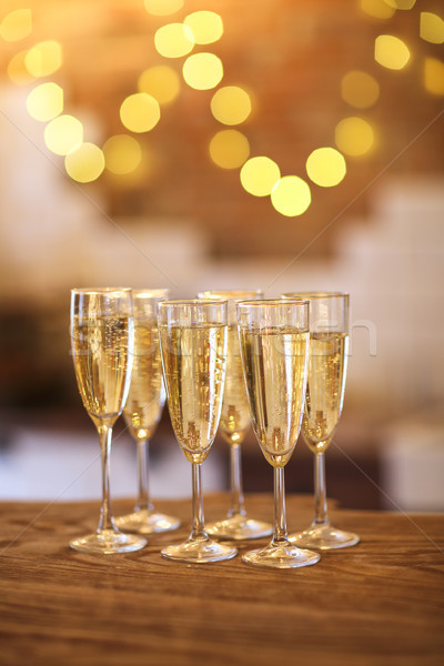Champagne glasses on golden background  Stock photo © dashapetrenko