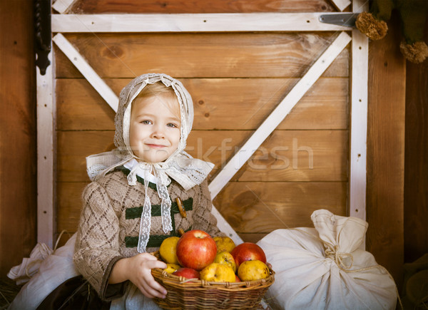 Vintage styled photo of little smiling girl in farm Stock photo © dashapetrenko