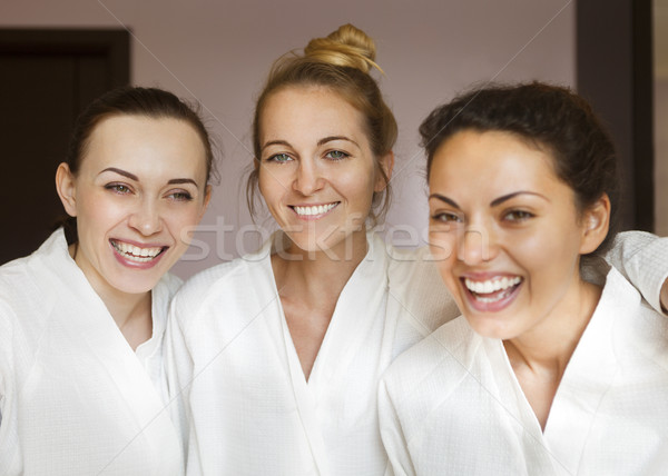 Three young happy women at spa resort Stock photo © dashapetrenko
