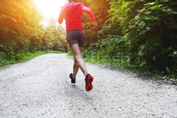 Young woman running on a countryside road Stock photo © dashapetrenko