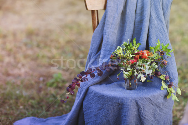Flower composition on the chair decorated with texstile  Stock photo © dashapetrenko