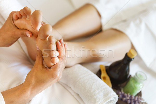 Massage of human foot in spa salon Stock photo © dashapetrenko