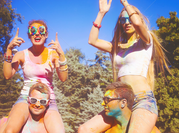 Happy friends on holi color festival Stock photo © dashapetrenko