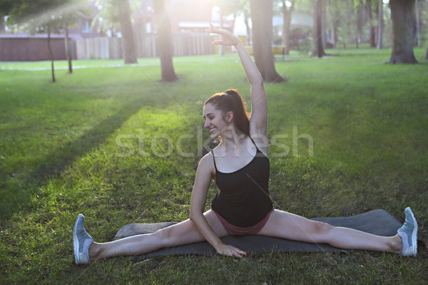 Stretching woman in outdoor exercise smiling happy doing stretch Stock photo © dashapetrenko