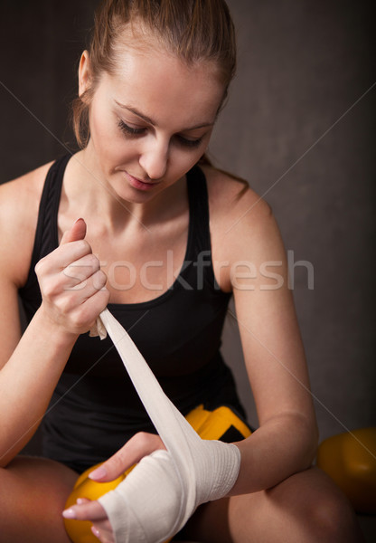 Woman boxer wearing white strap on wrist Stock photo © dashapetrenko