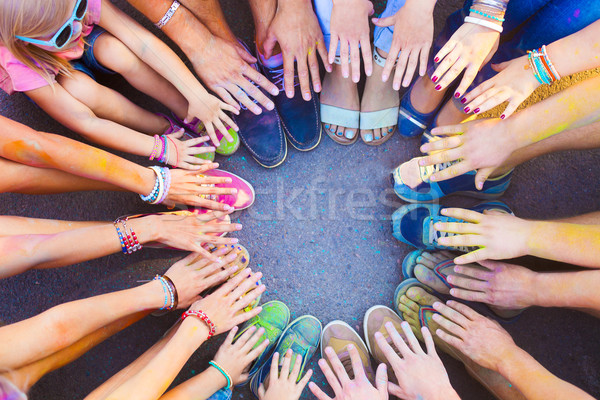 Friends putting their feet and hands together in a sign of unity Stock photo © dashapetrenko