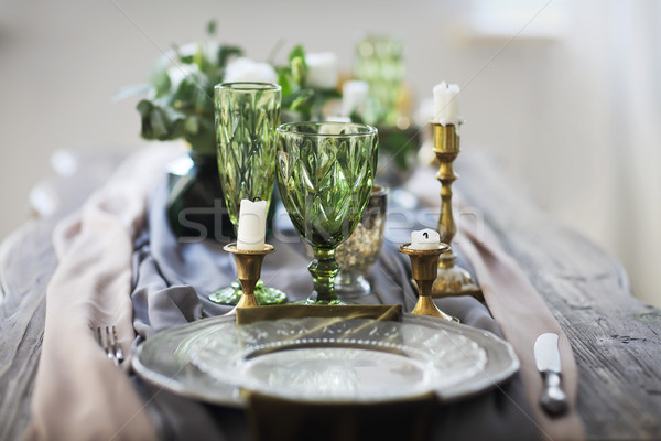 Festive table decorated with candles and covered with a tableclo Stock photo © dashapetrenko