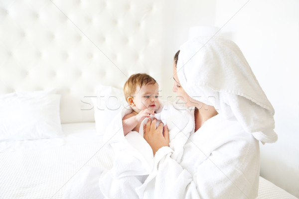 Young woman in the room with baby after bath Stock photo © dashapetrenko