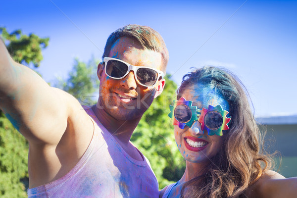 Happy couple in love on holi color festival Stock photo © dashapetrenko