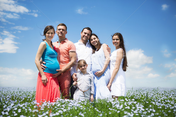 Portrait of a young big pregnant family in linen field Stock photo © dashapetrenko