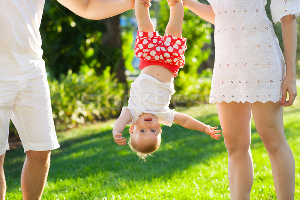 Funny family with baby girl in the park Stock photo © dashapetrenko