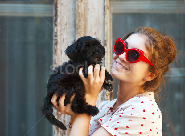 Young brunette woman hugging her lap dog puppy Stock photo © dashapetrenko