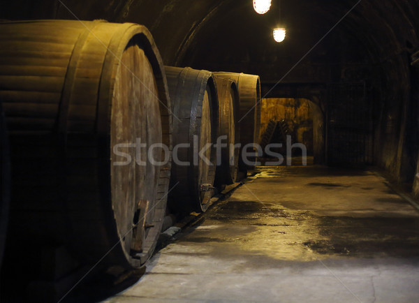 Old big oak barrels in winery cellar Stock photo © dashapetrenko