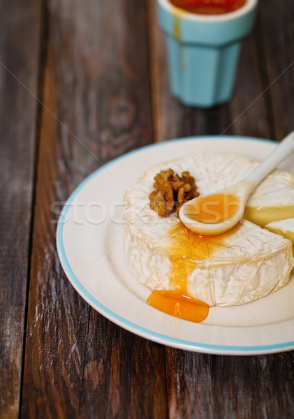 Cheese platter with nuts and jam  Stock photo © dashapetrenko
