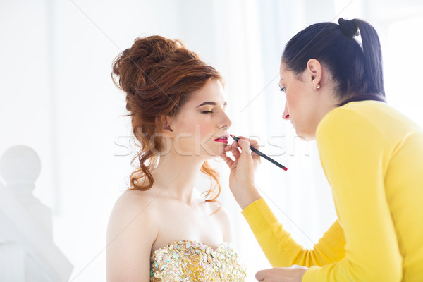 Make-up artist doing make up for young beautiful bride  Stock photo © dashapetrenko