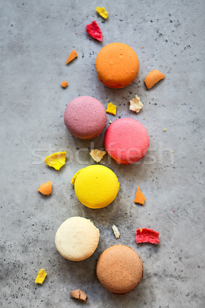 Stack of colorful French macarons on a dark rustic background Stock photo © dashapetrenko