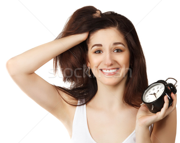 Surprised young brunette woman holding clock  Stock photo © dashapetrenko