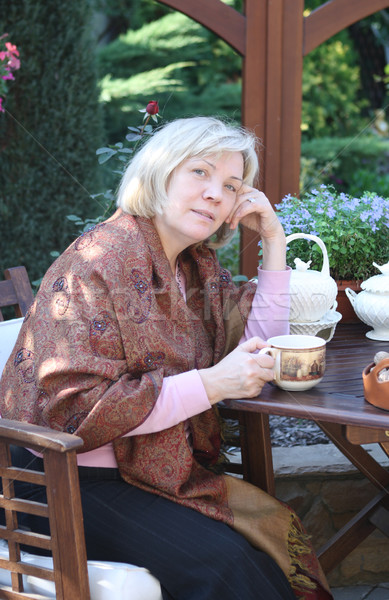 Middle age woman in the garden Stock photo © dashapetrenko