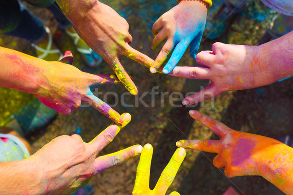 Friends putting their hands together in a sign of unity and team Stock photo © dashapetrenko