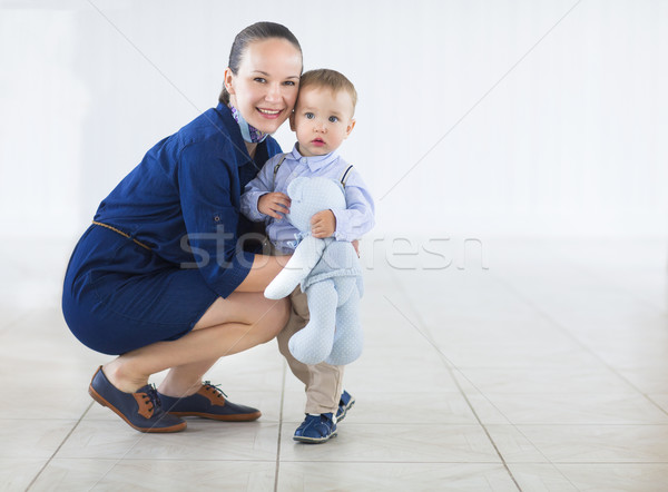 Happy mummy and her kid on a white background Stock photo © dashapetrenko