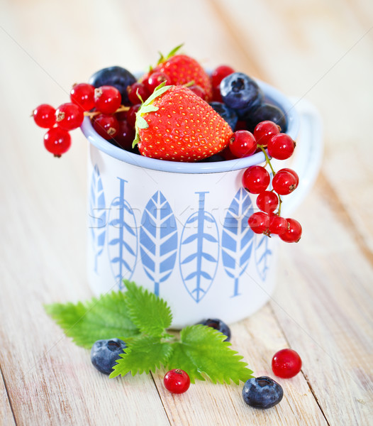 Delicious fresh fruits in the white and blue cup  Stock photo © dashapetrenko