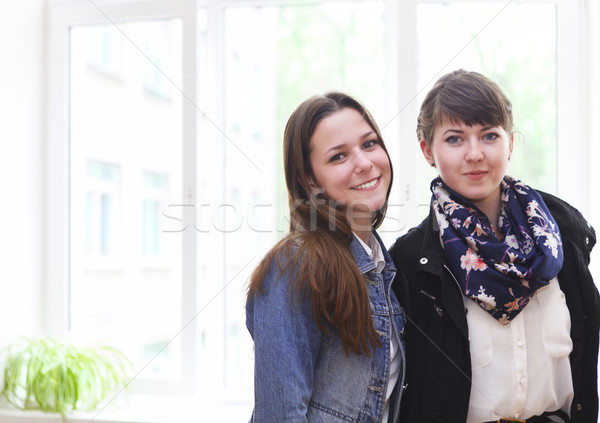 Stock photo: Two female students near the window in classroom