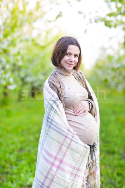 Beautiful pregnant woman in blooming garden Stock photo © dashapetrenko