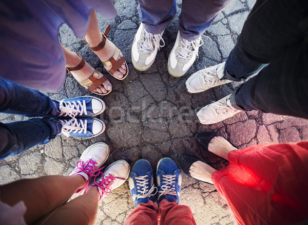 Group of friends with their legs in a complete circle  Stock photo © dashapetrenko