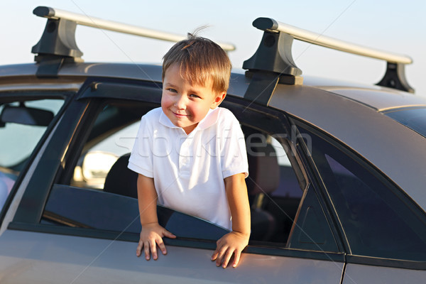 Portrait of a smiling little boy at beach in the car Stock photo © dashapetrenko