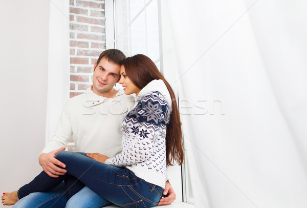 Couple wearing winter clothes at home relaxing Stock photo © dashapetrenko