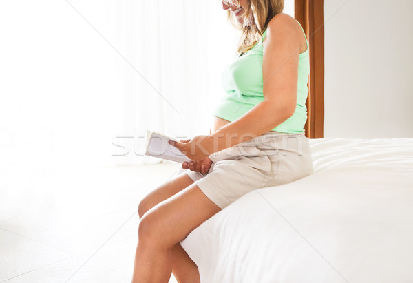 Pregnancy, motherhood- close up of happy pregnant woman with boo Stock photo © dashapetrenko