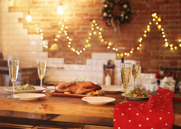 Stock photo: Christmas dinner with roast duck and champagne