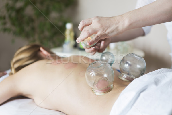 Young woman getting treatment at medical clinic Stock photo © dashapetrenko